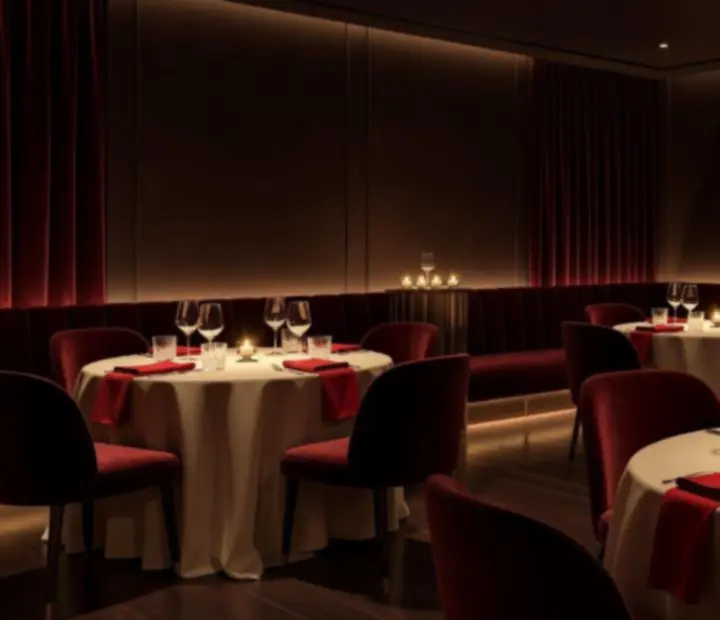 Dimly lit Melbourne supper venue with dark velvet lounges and candlelit tables